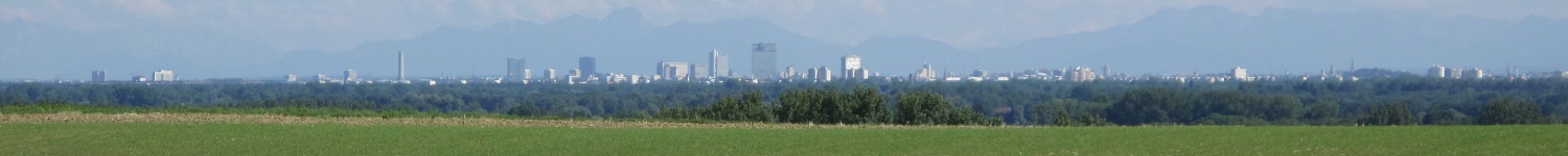 View of Munich skyline with alps in the background, as seen from near Mariabrunn beer garden.